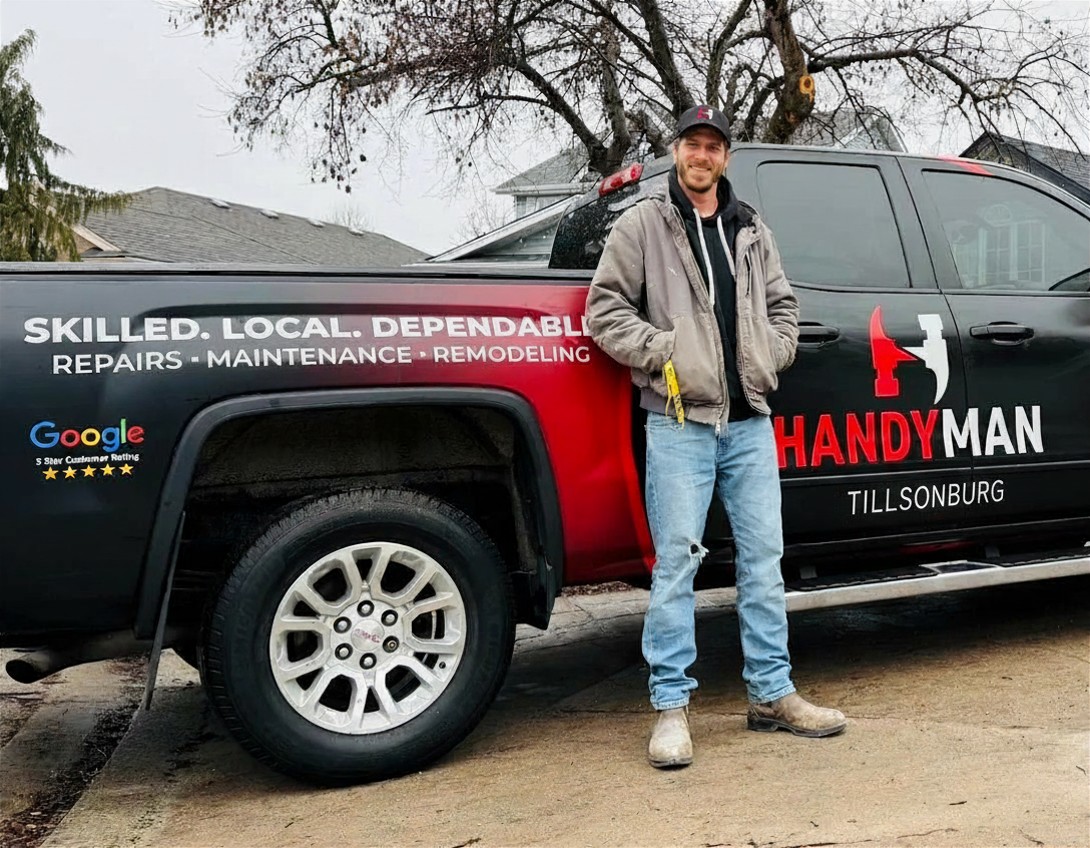 Handyman Tillsonburg owner standing beside the branded service truck